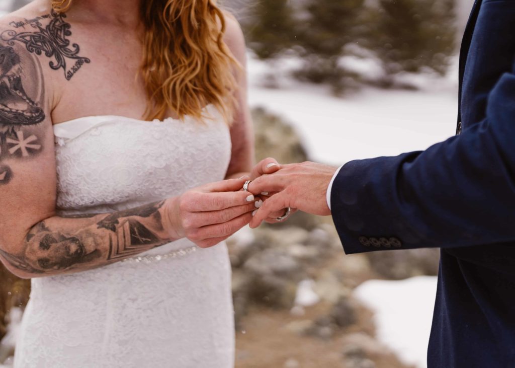Couple exchanges rings during their Breckenridge, Colorado elopement