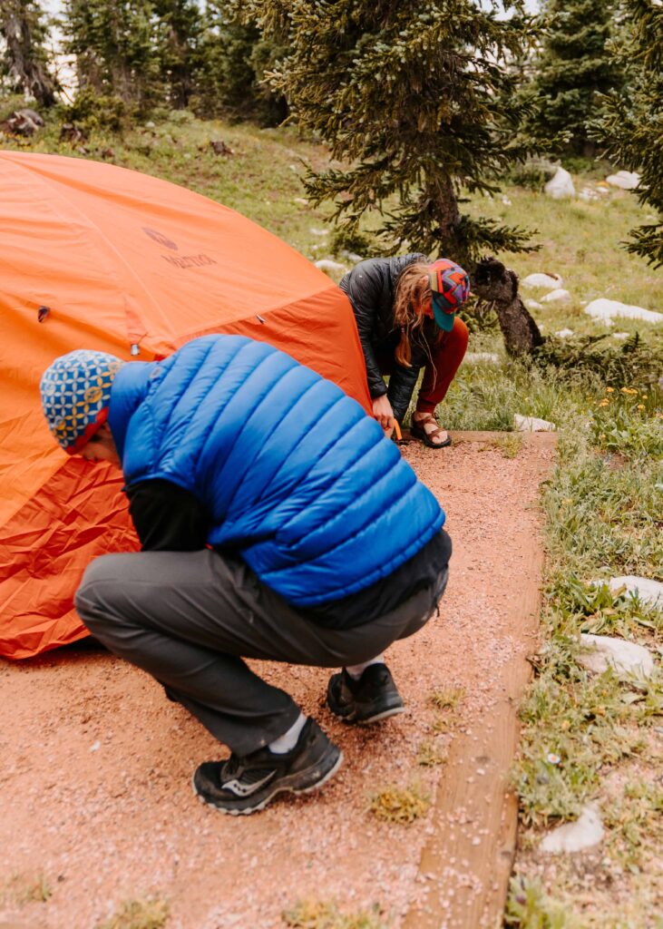 Couple sets up a tent together 