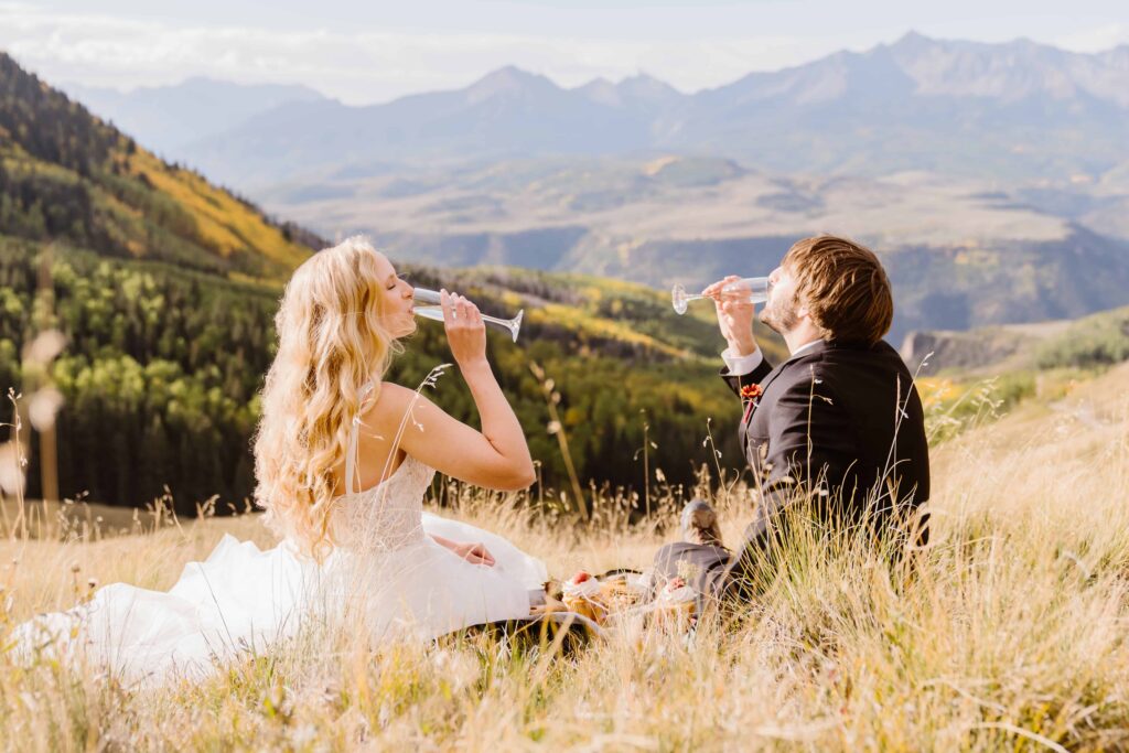 Couple celebrates their wedding by drinking champagne