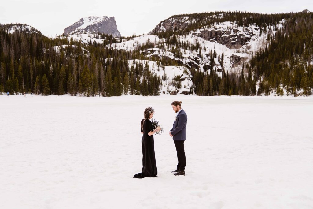 Couple exchanges vows during their Winter Rocky Mountain National Park Elopement