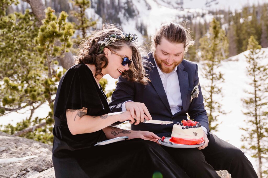 Bride and groom eat cake together after their ceremony