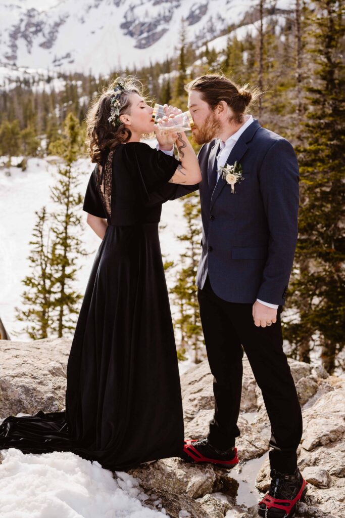 Bride and groom have portraits at Emerald Lake in Rocky Mountain National Park