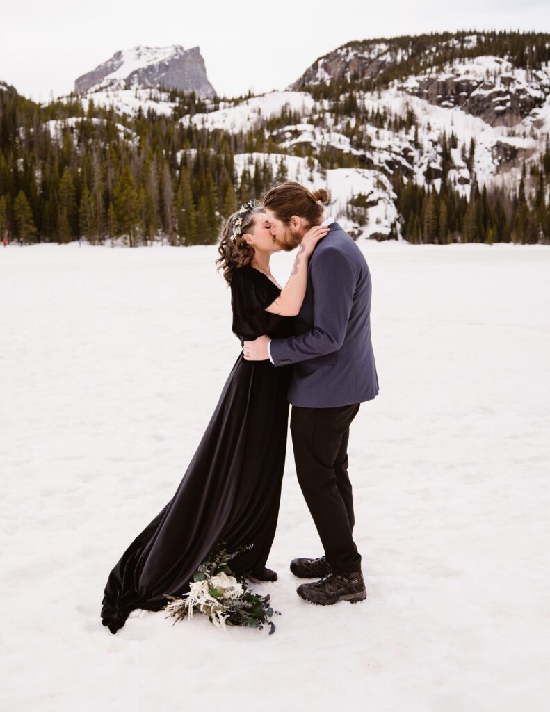 Couple exchanges vows during their Winter Rocky Mountain National Park Elopement