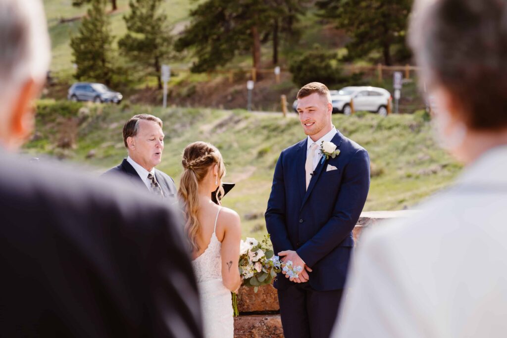 Groom admires bride during their ceremony