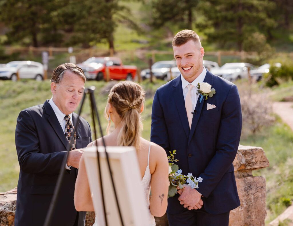 Groom laughs during ceremony