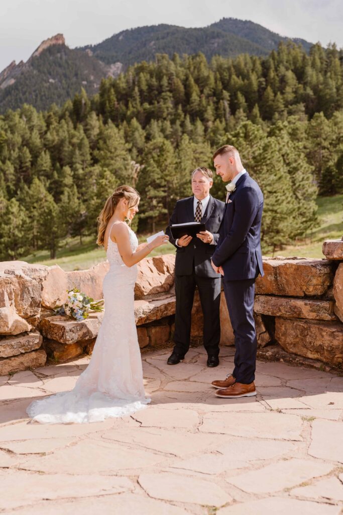 Bride reads her vows at her mountain wedding in Boulder, Colorado