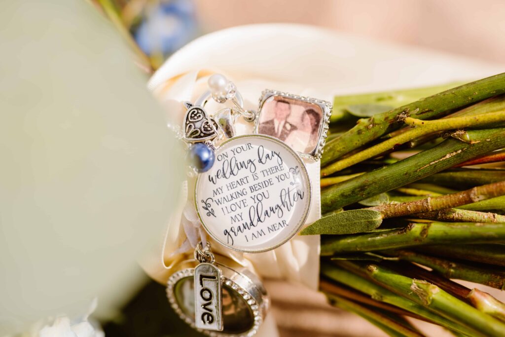 Close up of charms on brides wedding bouquet