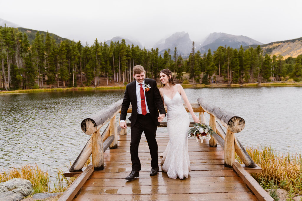 Couple gets their portraits after their elopement at Sprague Lake in Rocky Mountain National Park in the fall