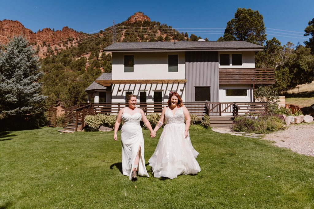 Lesbian couple gets ready together before their elopement in Aspen, Colorado