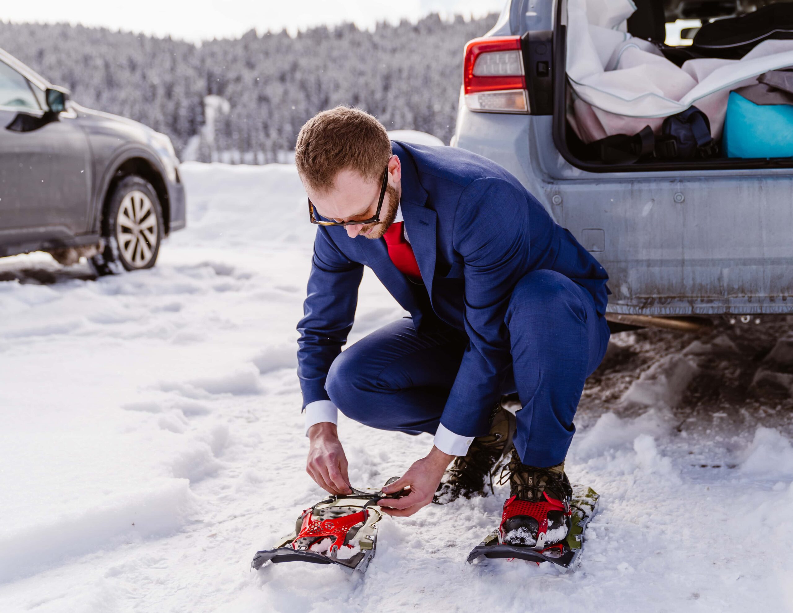 Couple puts on snowshoes for their winter elopement in Breckenridge, Colorado