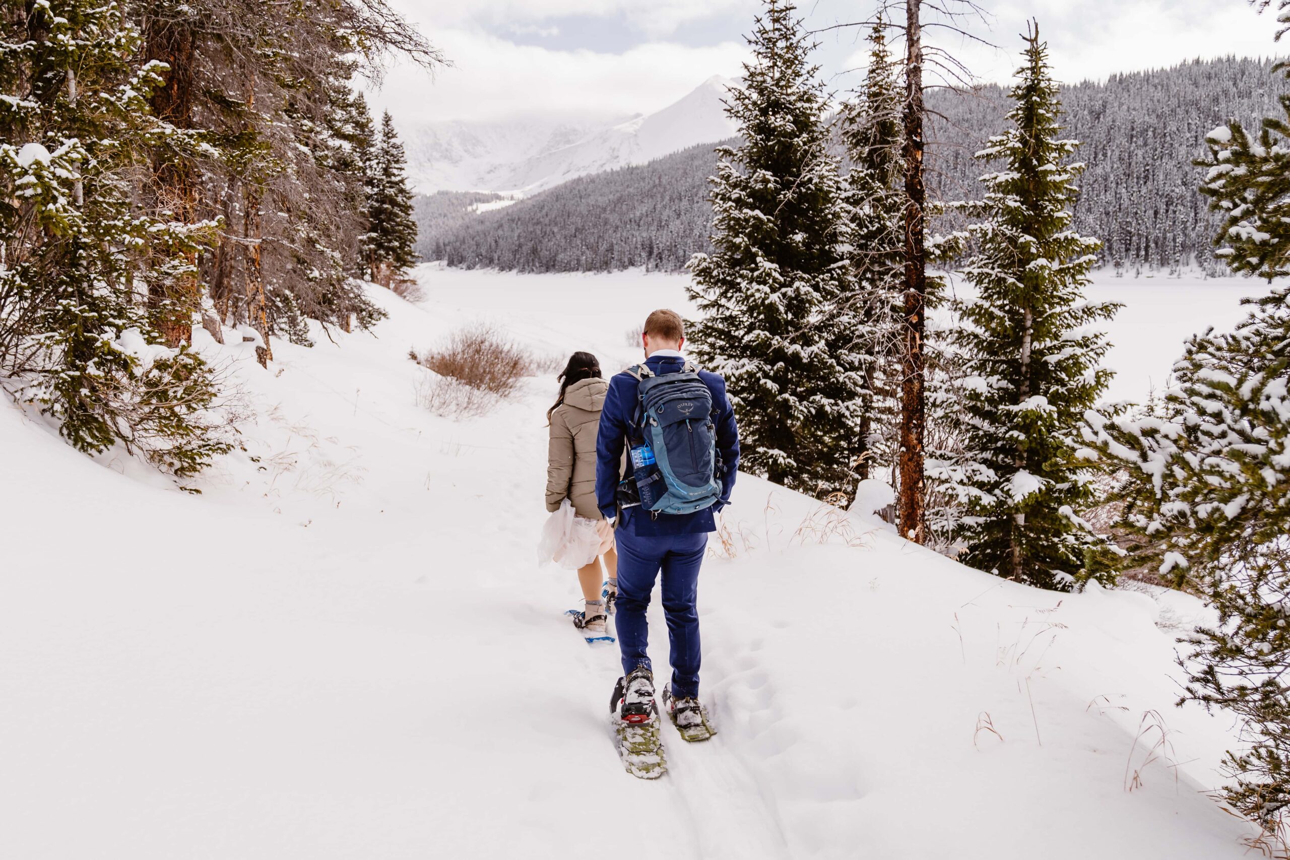 Couple snowshoes for their winter elopement in Breckenridge, Colorado