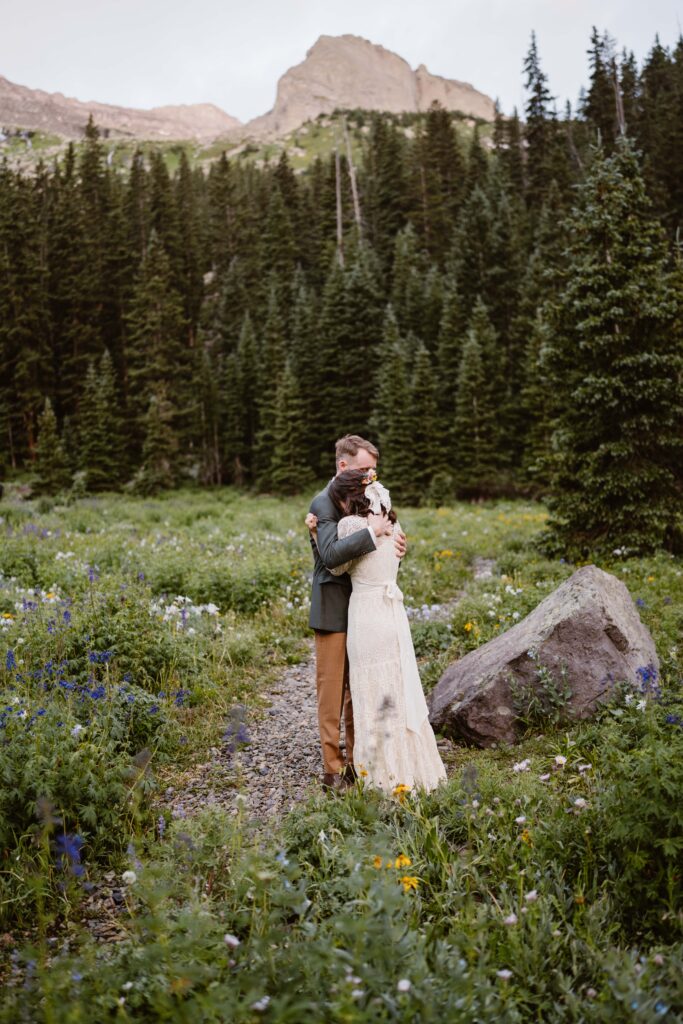 Couple has their first look at their elopement at Blue Lakes in Ridgway, Colorado