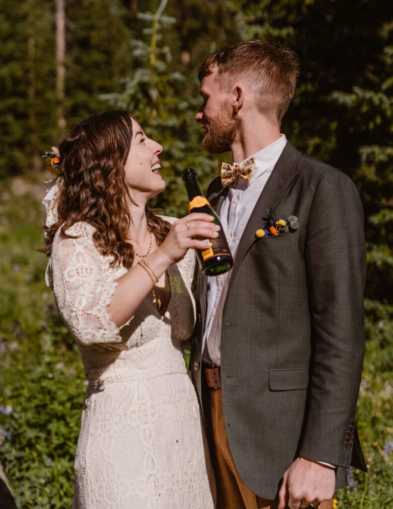 Couple celebrates their elopement with champagne in Colorado