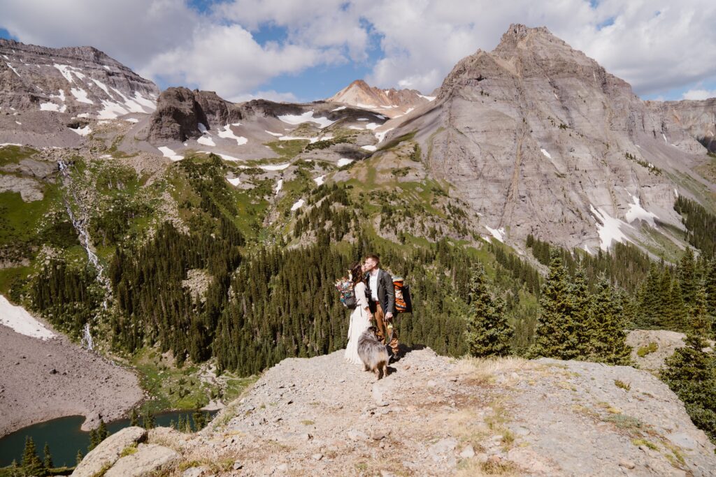 Couple takes wedding pictures on top of a mountain in Telluride, Colorado