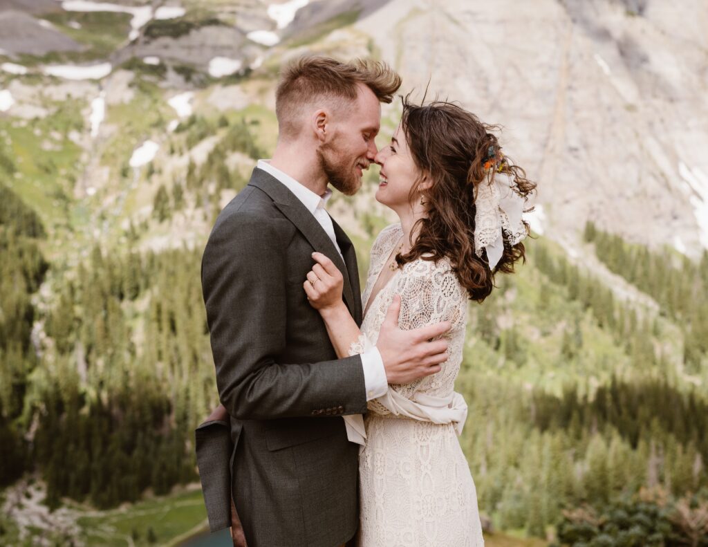 Couple takes wedding pictures on top of a mountain in Telluride, Colorado