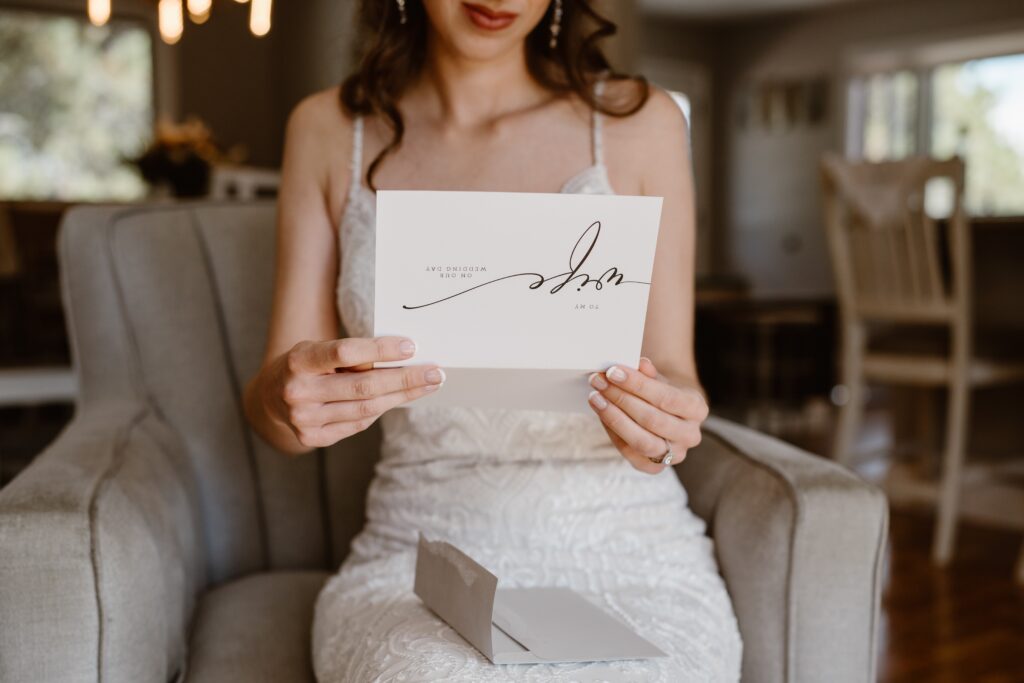 Bride reads letter from groom before their 3M Curve elopement