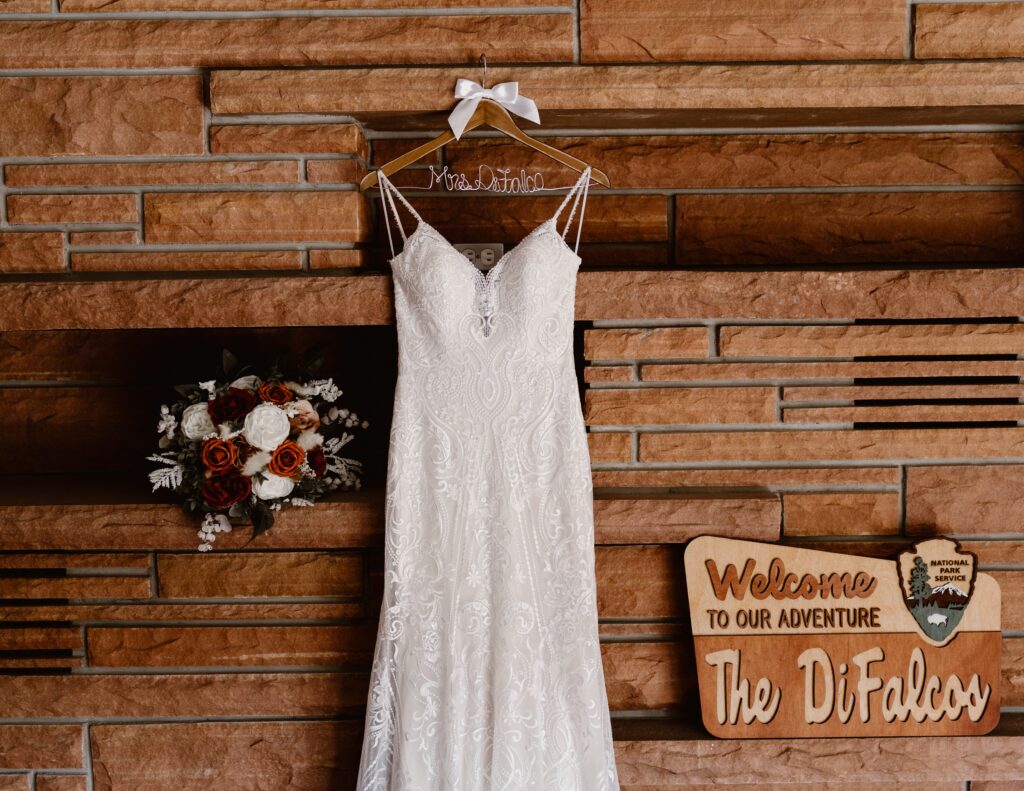 wedding gown hanging up on a fireplace