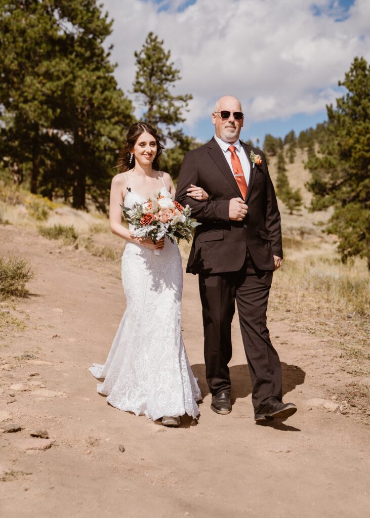 Brides walks down aisle with dad