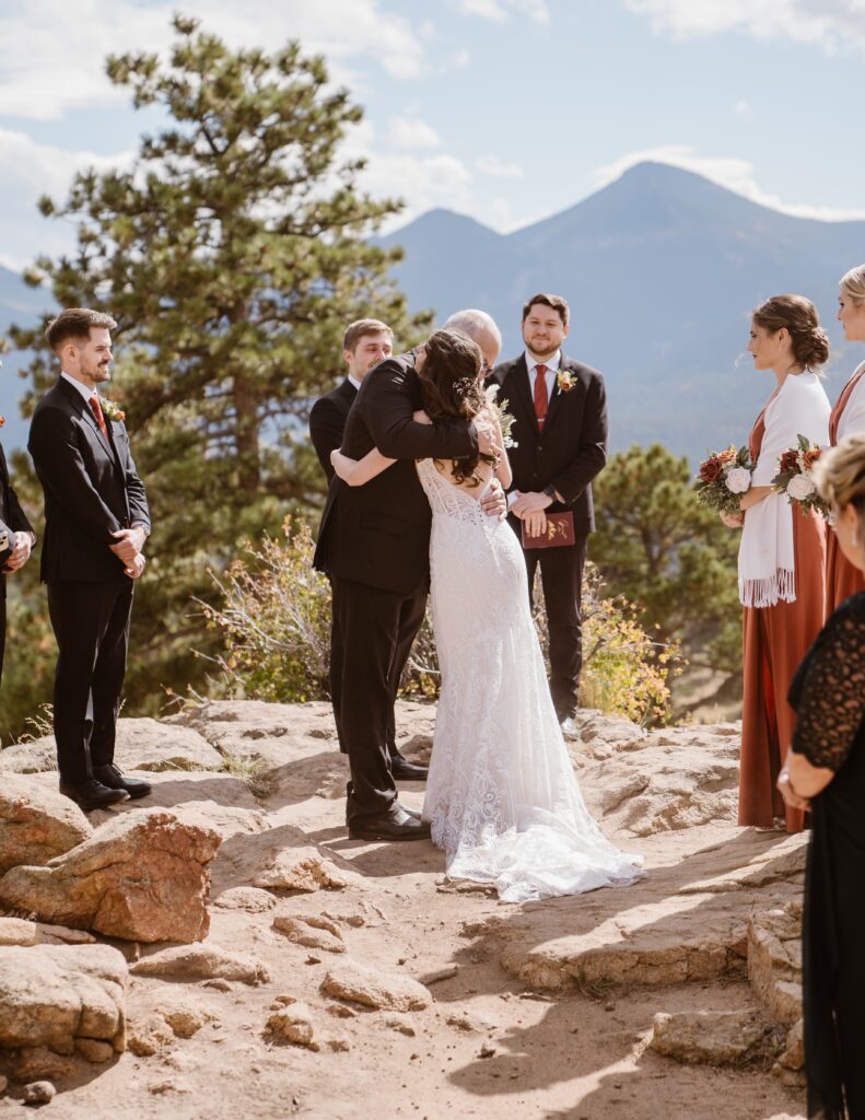 Bride hugs dad before 3M Curve elopement at Rocky Mountain National Park