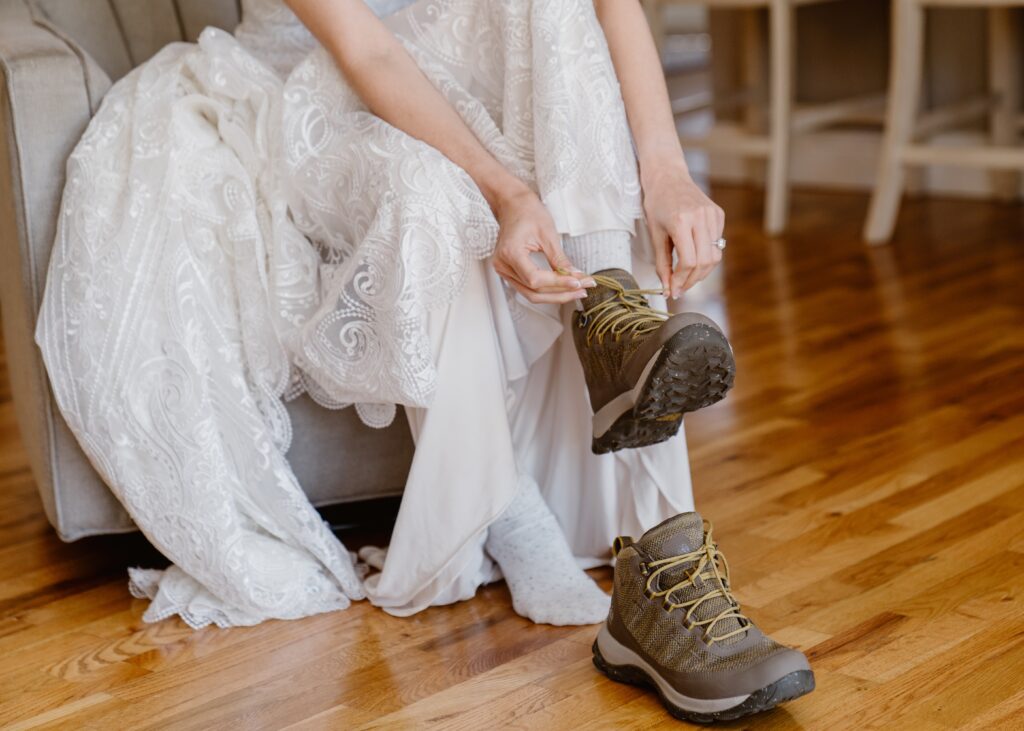 Bride puts her hiking boots on for her 3M Curve elopement in Rocky Mountain National Park
