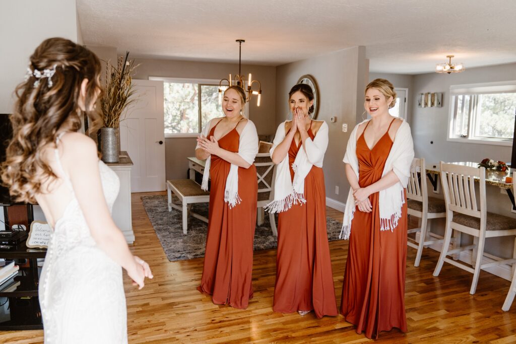 Bride has a first look with her three bridesmaids