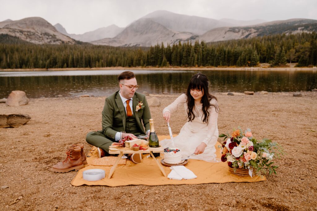 Bride and groom have a picnic before their elopement ceremony