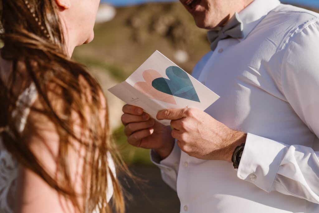 couple reads heartfelt vows to each other during their colorado elopement