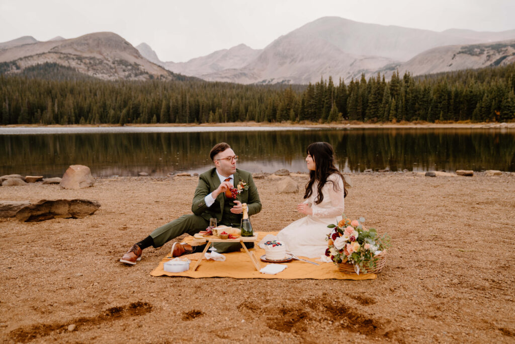 Couple has a picnic during their Colorado elopement in the mountains
