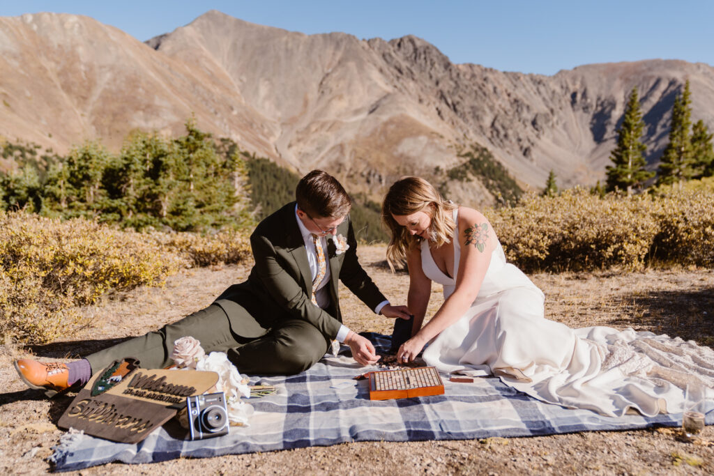 Couple plays Scrabble during their Colorado elopement