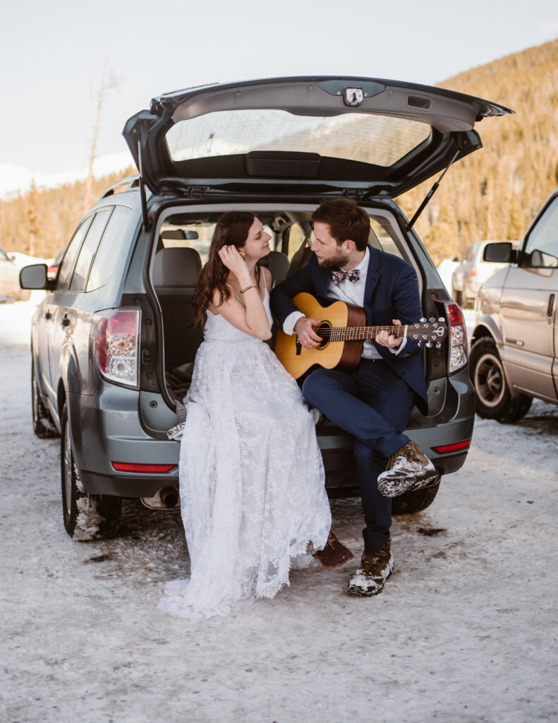 Couple plays the guitar together after their colorado elopement