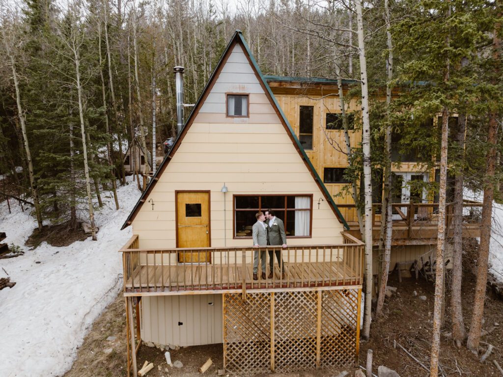 couple gets ready for their wedding at an a frame cabin