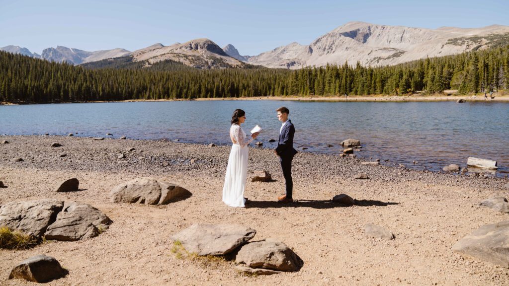 couple elopes on the shore of an alpine lake in Colorado