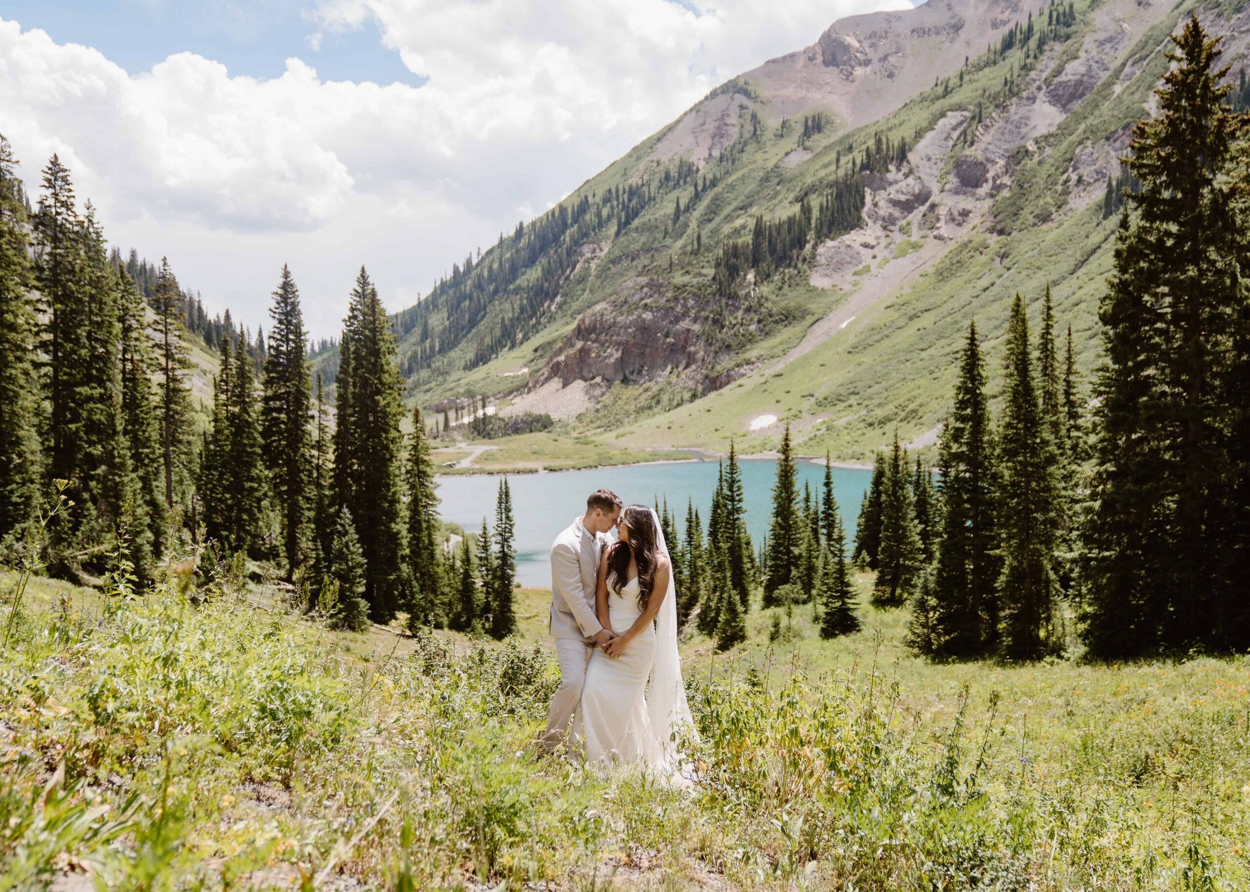 couple elopes in Crested Butte, Colorado in the summertime at an alpine lake