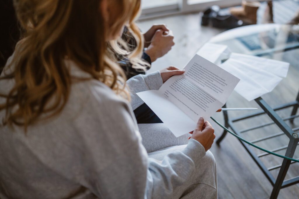 Couple reading letters from family during their intimate elopement day
