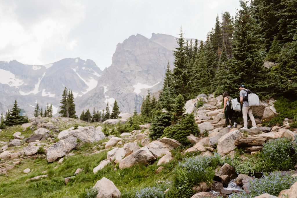 Couple hikes for their summertime elopement with Colorado elopement photographer and videographer Alpine Vows