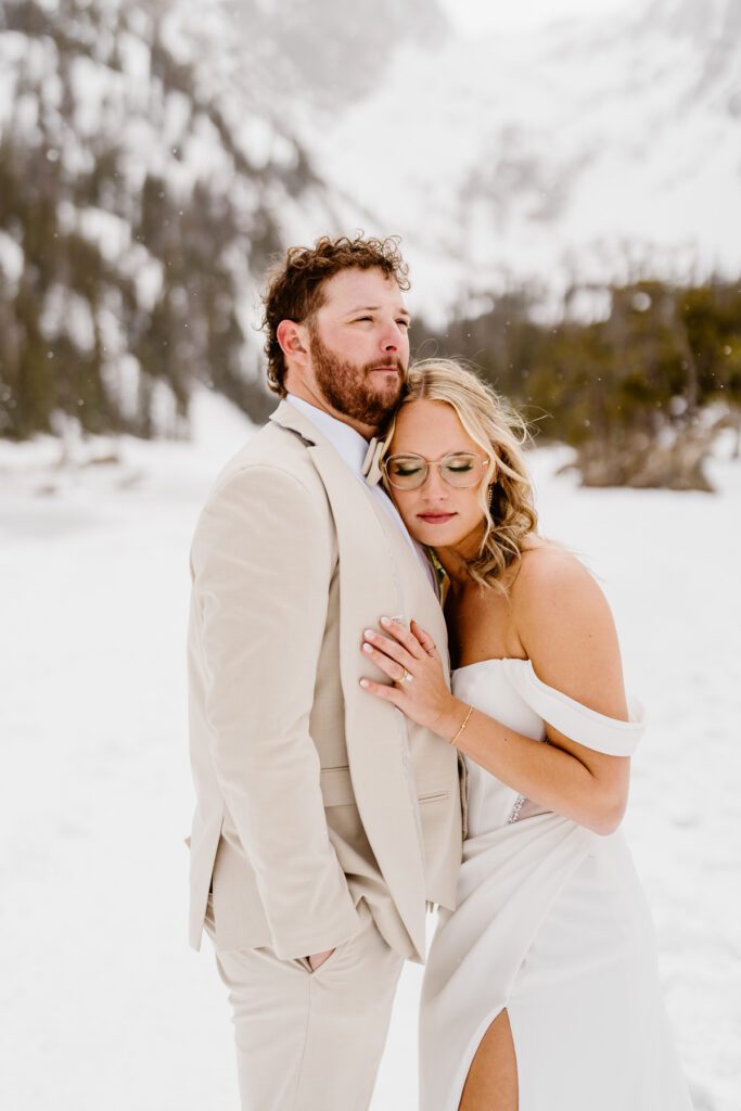 Bride and groom portraits at Dream Lake in Rocky Mountain National Park in the winter time