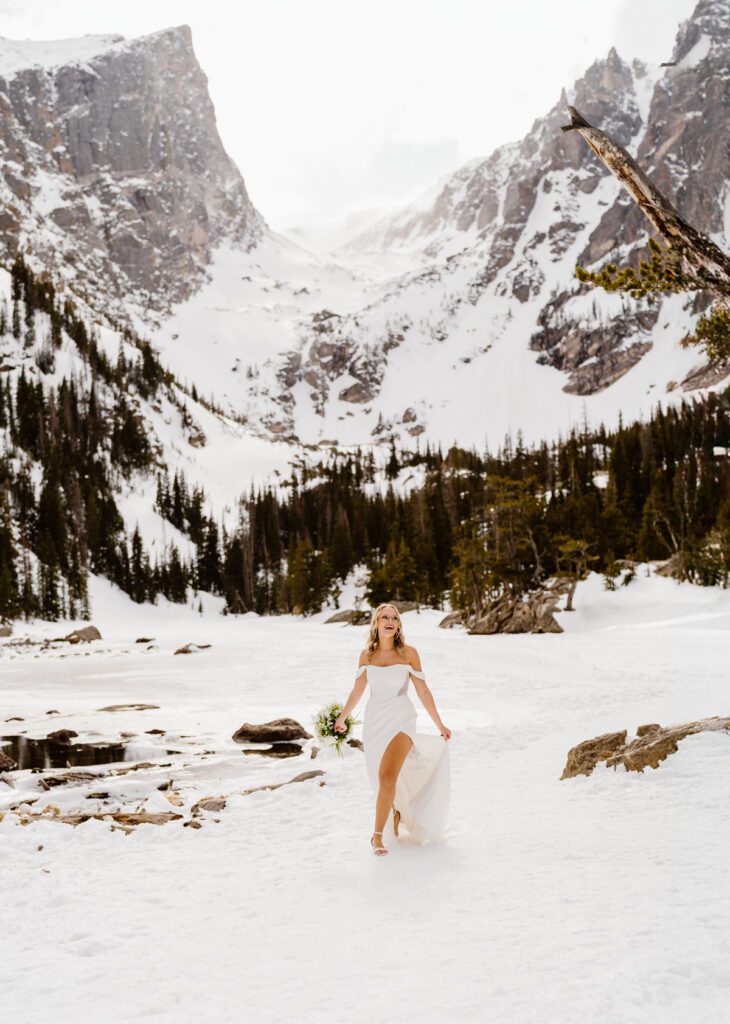 Bride and groom portraits at Dream Lake in Rocky Mountain National Park in the winter time