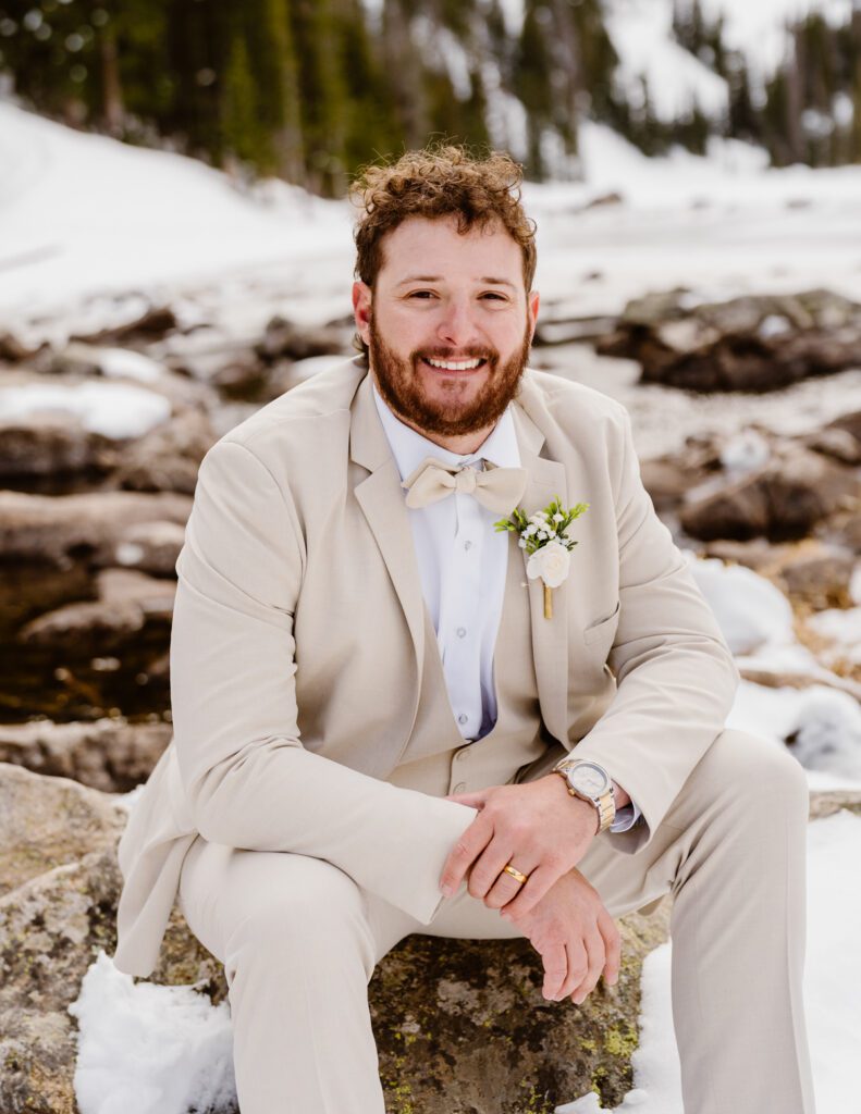 Bride and groom portraits at Dream Lake in Rocky Mountain National Park in the winter time