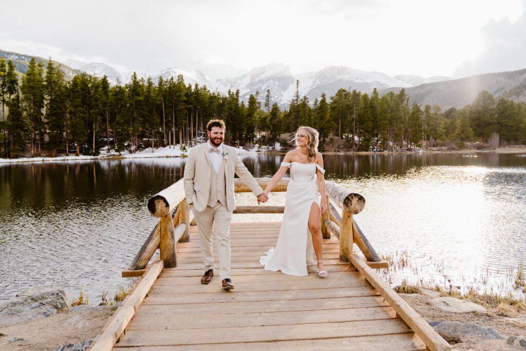 Bride and groom portraits at Sprague Lake in Rocky Mountain National Park in the winter time