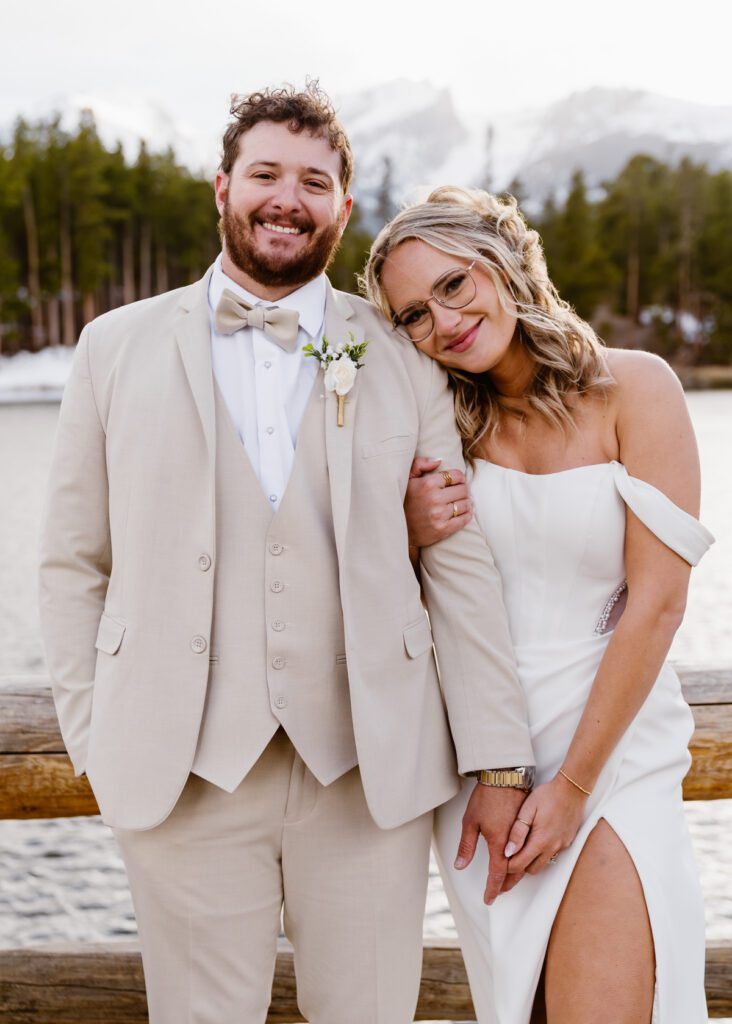 Bride and groom portraits at Sprague Lake in Rocky Mountain National Park in the winter time