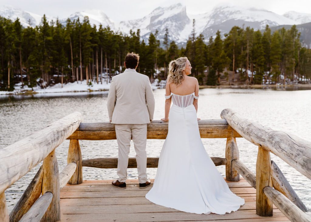 Bride and groom portraits at Sprague Lake in Rocky Mountain National Park in the winter time