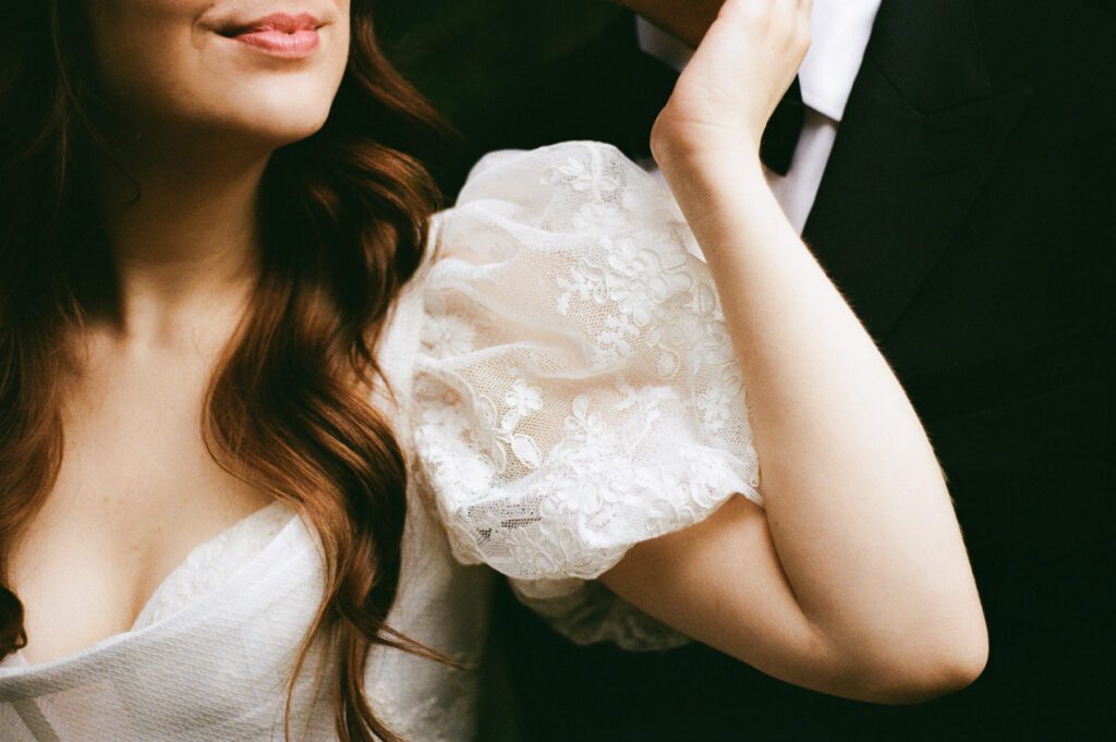 Film wedding portraits of a bride and groom in the summertime at the Maroon Bells Amphitheater in Aspen, Colorado