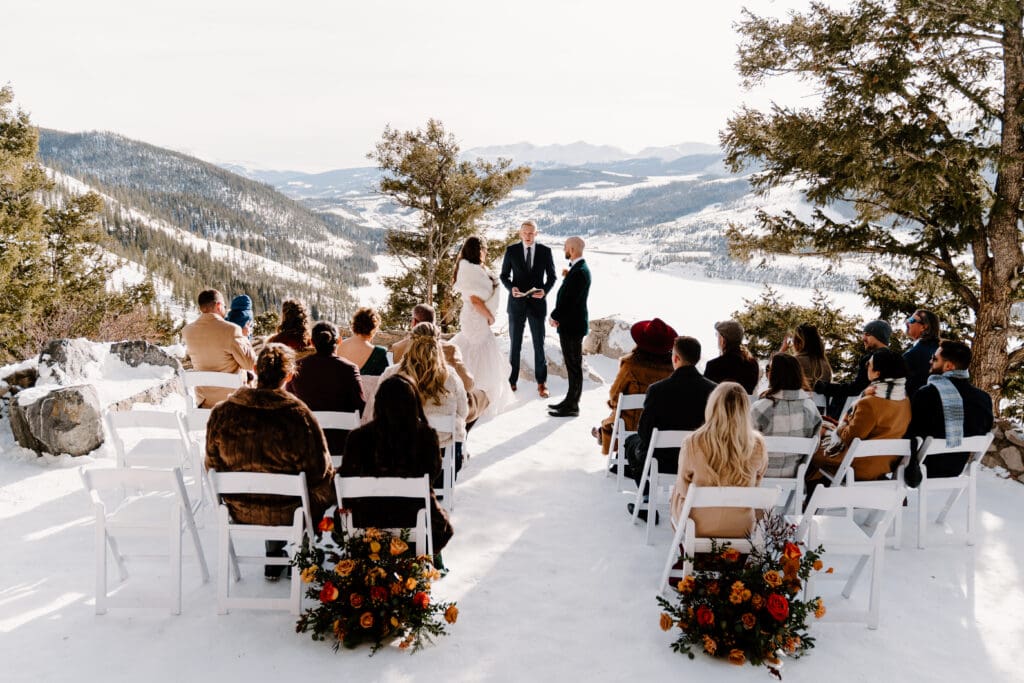 Micro wedding ceremony in the wintertime at Sapphire Point Overlook in Breckenridge, Colorado